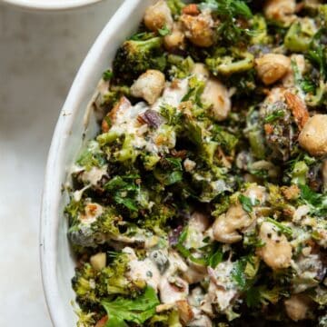 High protein roasted broccoli salad with crispy white beans, almonds, fresh herbs, and lemon yogurt dressing.