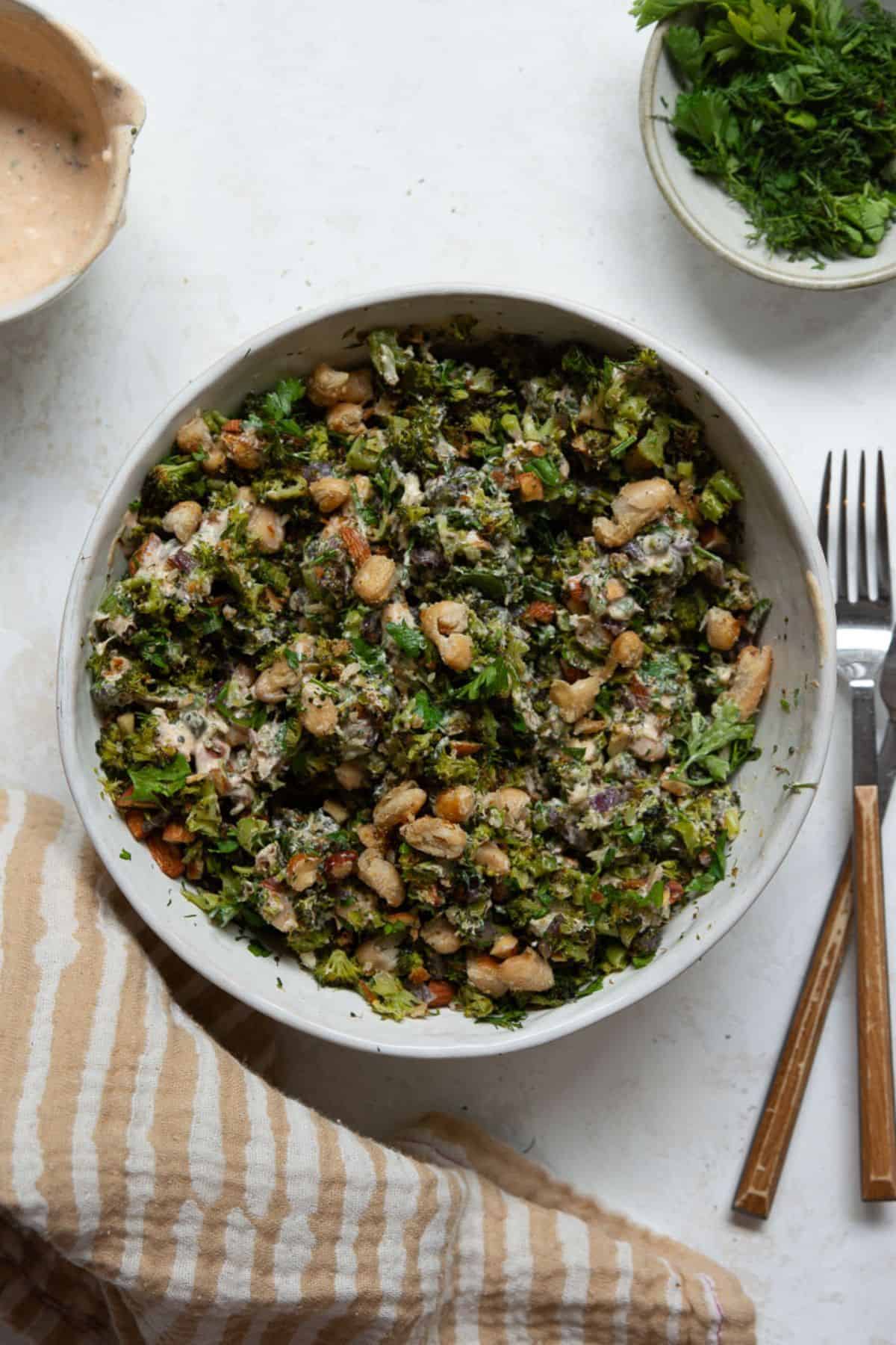 Roasted broccoli salad tossed with lemon yogurt dressing, herbs, and almonds.