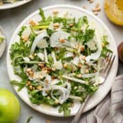 Shaved fennel apple salad with arugula, shaved Parmesan, and toasted pine nuts.